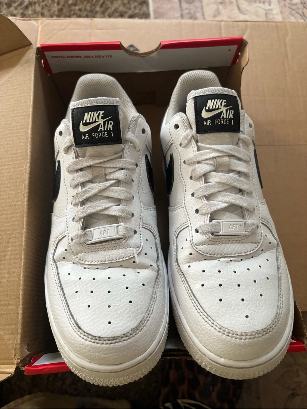 Nike White Low-Top Sneakers with Black Swoosh